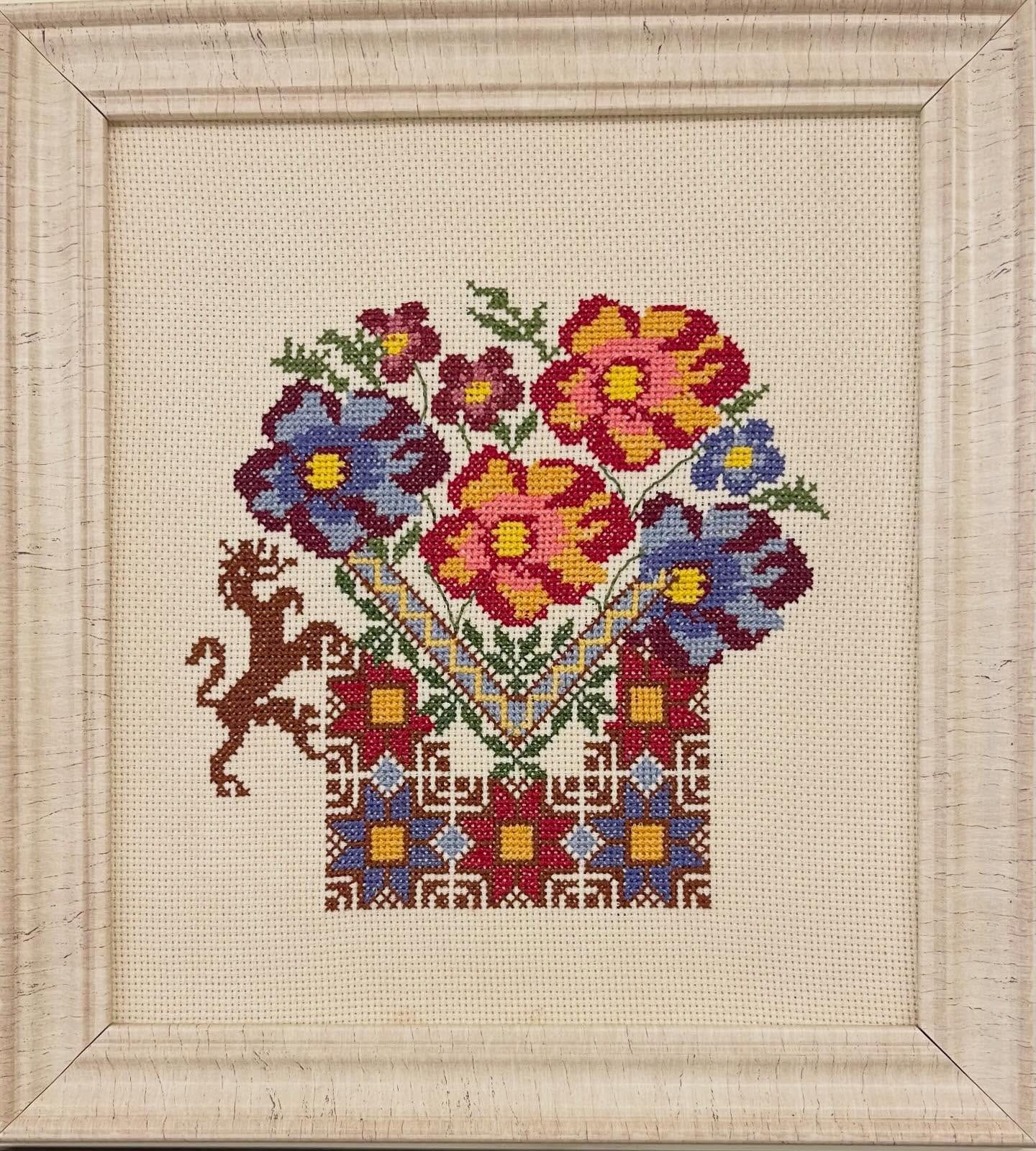 Framed cross-stitch piece
